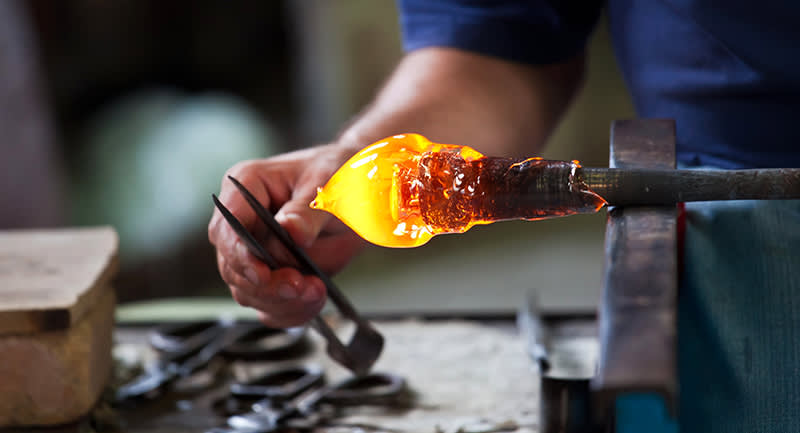 Glass blower creating a beautiful piece in Murano