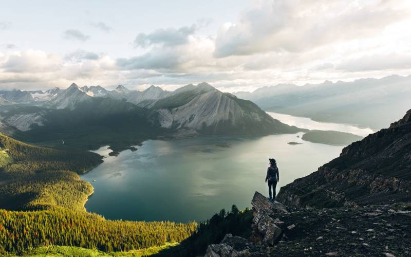 a group of people standing on the side of a mountain