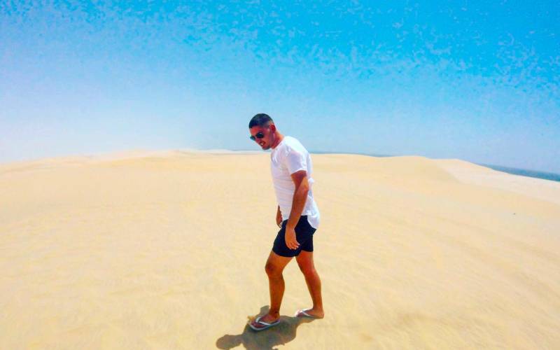a man standing on a beach