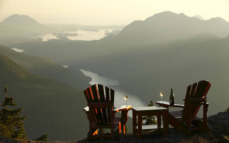 a chair sitting in front of a mountain