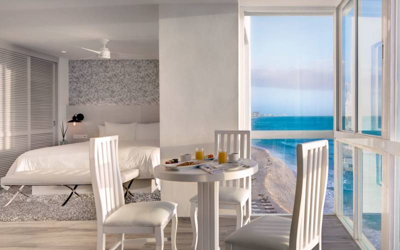 a dining room table in front of a window