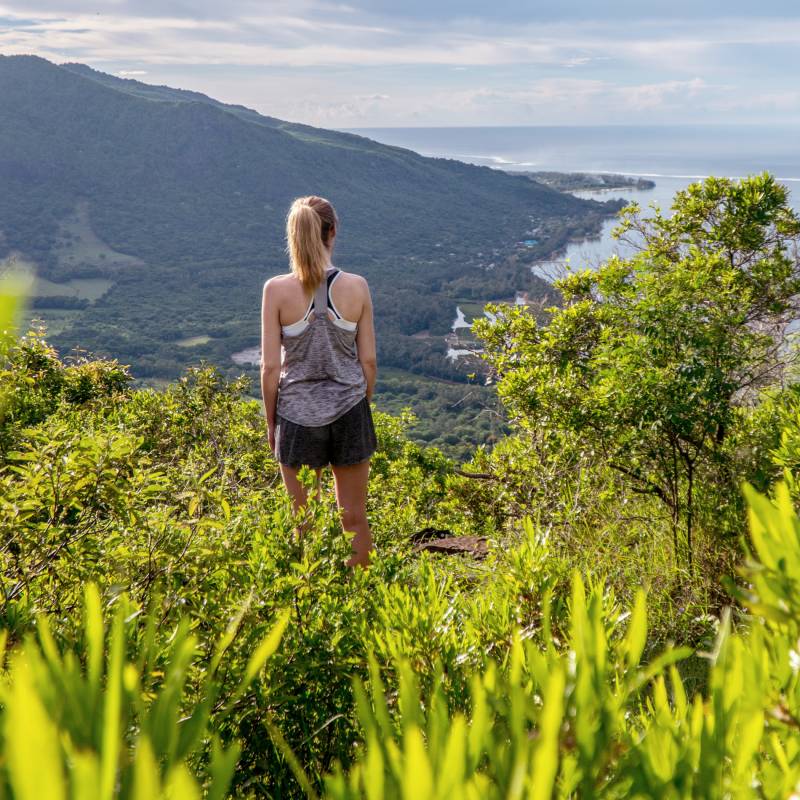 Girls standing at Le morne Brabant, Mauritius island