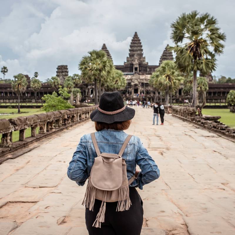 Women tourists wear jacket jeans walking into Angkor Wat landmark in Siem Reap, Cambodia, Asia