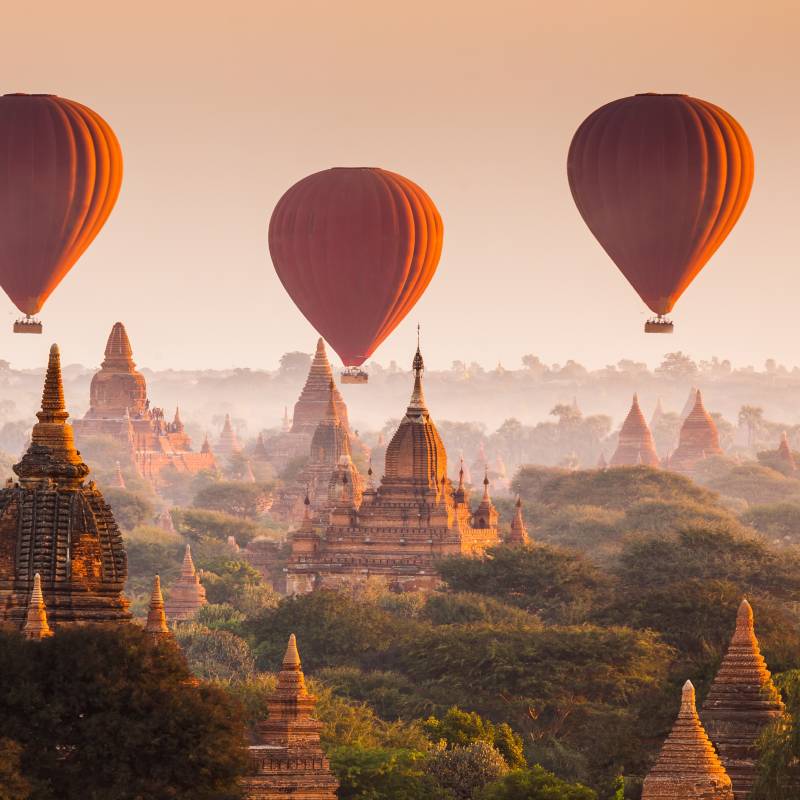 Enchanting Travels Asia Tours Hot air balloon over plain of Bagan at sunrise, Myanmar