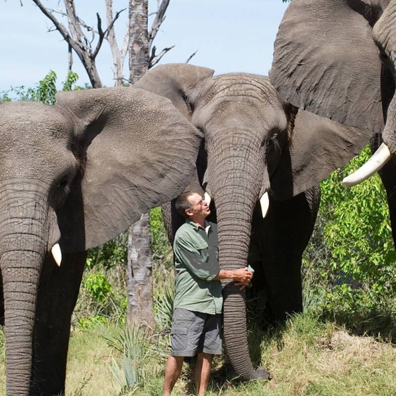 Enchanting Travels-Botswana Tours-Okavango Delta-Sanctuary Stanley's Camp-Doug hugging Tembi Marula and Jabu low