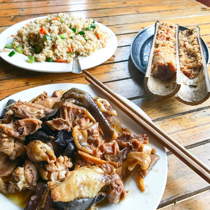 Enchanting Travels China Tours Local dinner with chicken and mushrooms in rustic eatery in area Dazhai Longsheng Rice Terraces