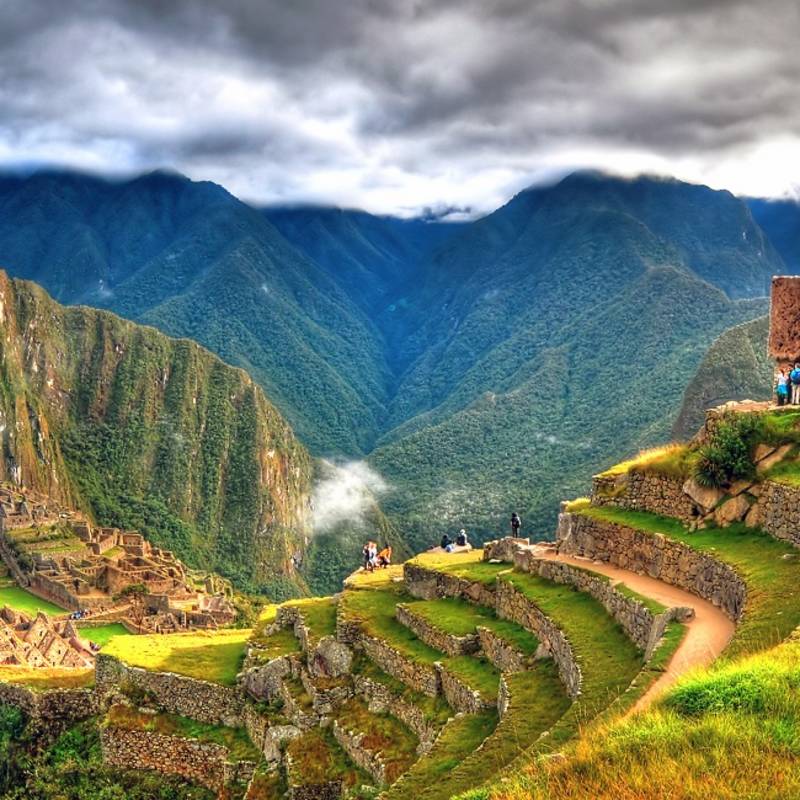 Enchanting Travels Peru Tours - Panoramic HDR image of Machu Picchu, the lost city of the Incas on a cloudy day. Machu Picchu is one of the new 7 Wonder of the Word near Cusco