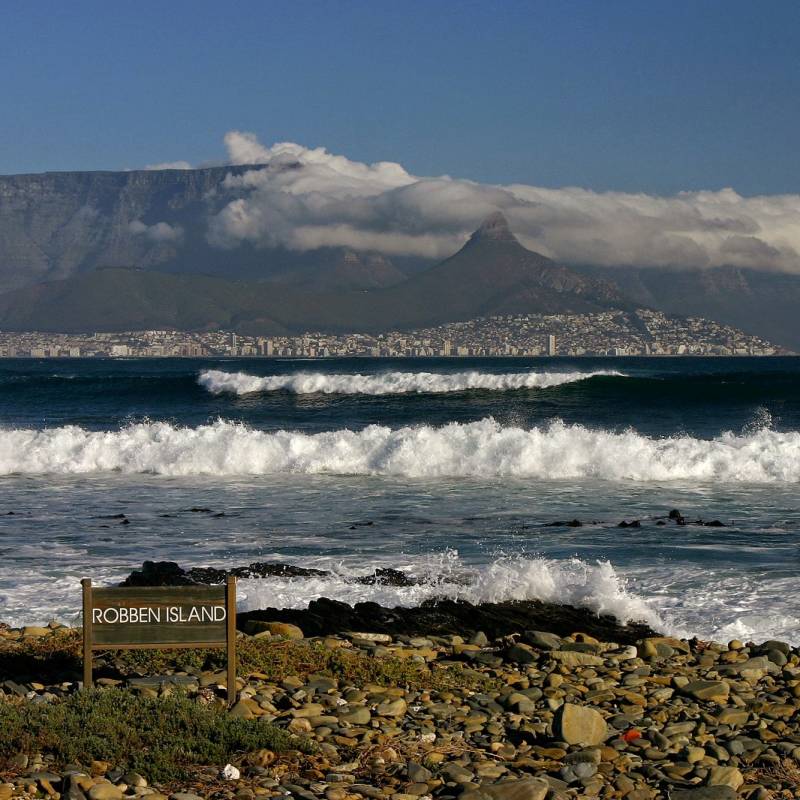 Enchanting Travels South Africa Tours Cape Town and Table mountain seen from the beach of Robben Island - history of South Africa