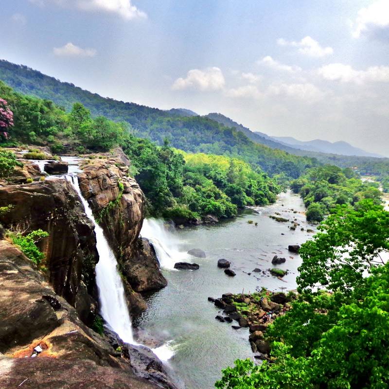 Witness the thundering Athirapally Waterfalls of Kerala during the monsoon season