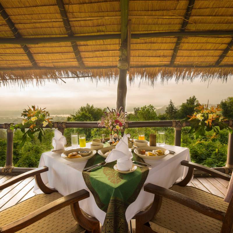 Set table at Four Seasons Tented Camp, Golden Triangle Hotel in Chiang Saen, Thailand