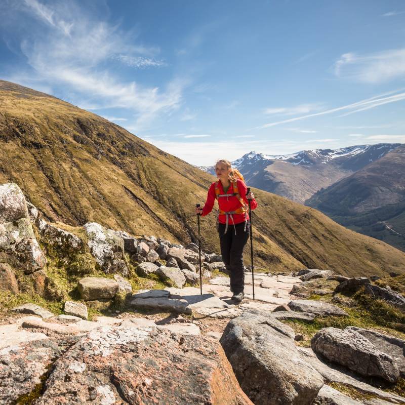 Enchanting Travels UK & Ireland Tours Pretty, young female hiker going uphill