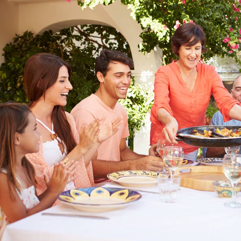 Family enjoying Spanish cuisine together