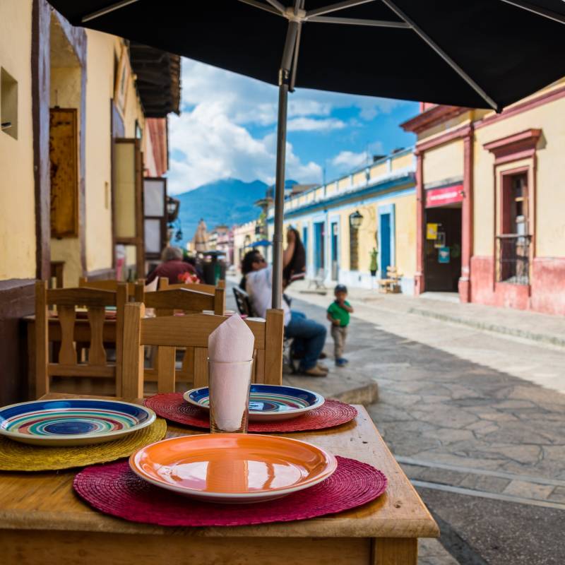 Restaurant view and sidewalk on San Cristobal de las Casas colonial town. Latin American Culture