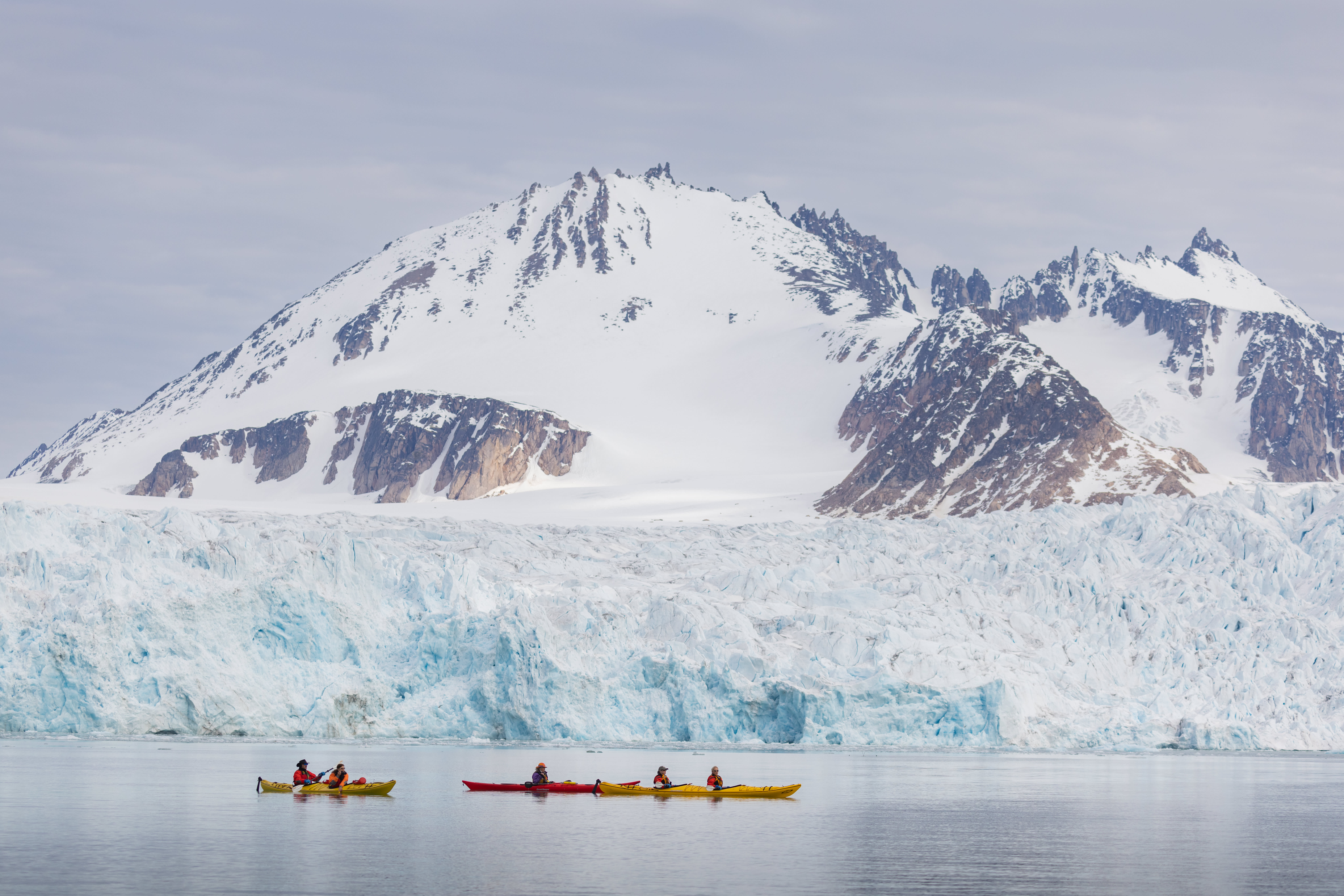 Guests participating in our Sea Kayaking Program in Svalbard. Photo by Michelle Sole.