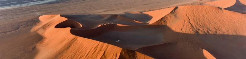 Aerial view of high red dunes, located in the Namib Desert, in the Namib-Naukluft National Park of Namibia, Africa