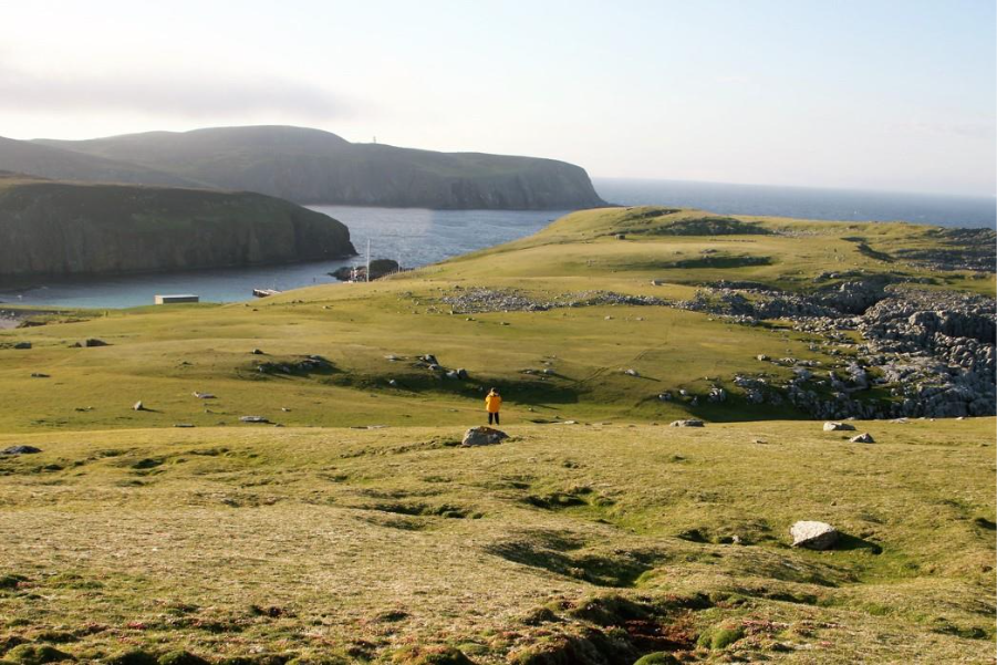 Guest hiking in Fair Isle island. Photo by Acacia Johnson. 