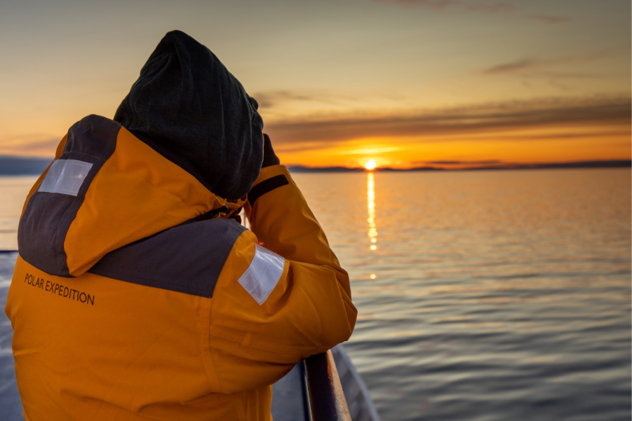 Guest taking photo of sunset onboard ship. Photo by Michelle Sole. 