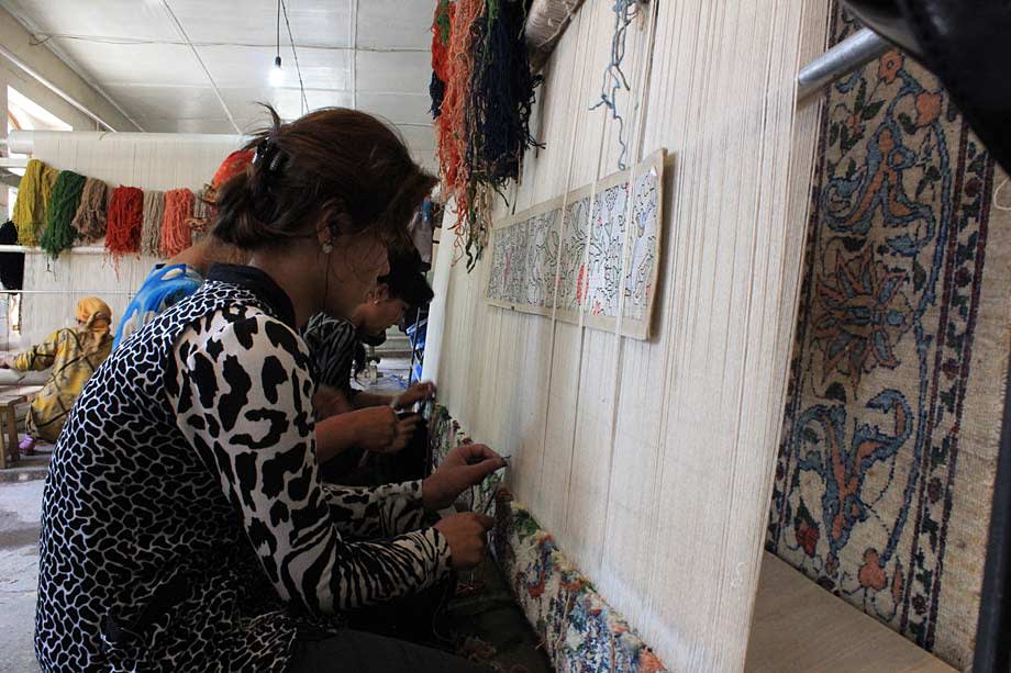 weaving a silk rug