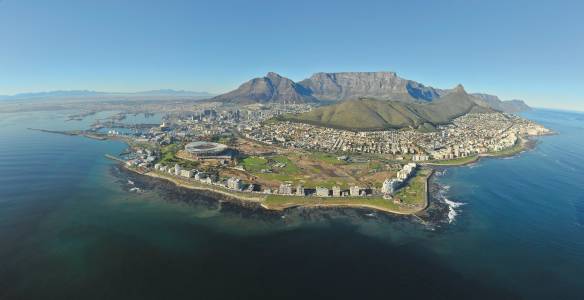 a view of a large body of water with a mountain in the background