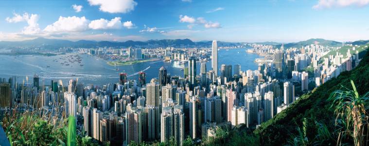 a view of Victoria Peak skyline with a mountain in the background