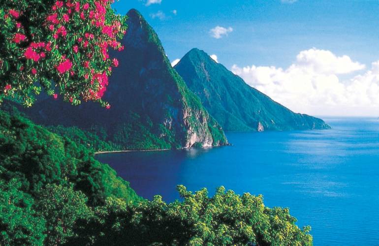a body of water with a mountain in the background