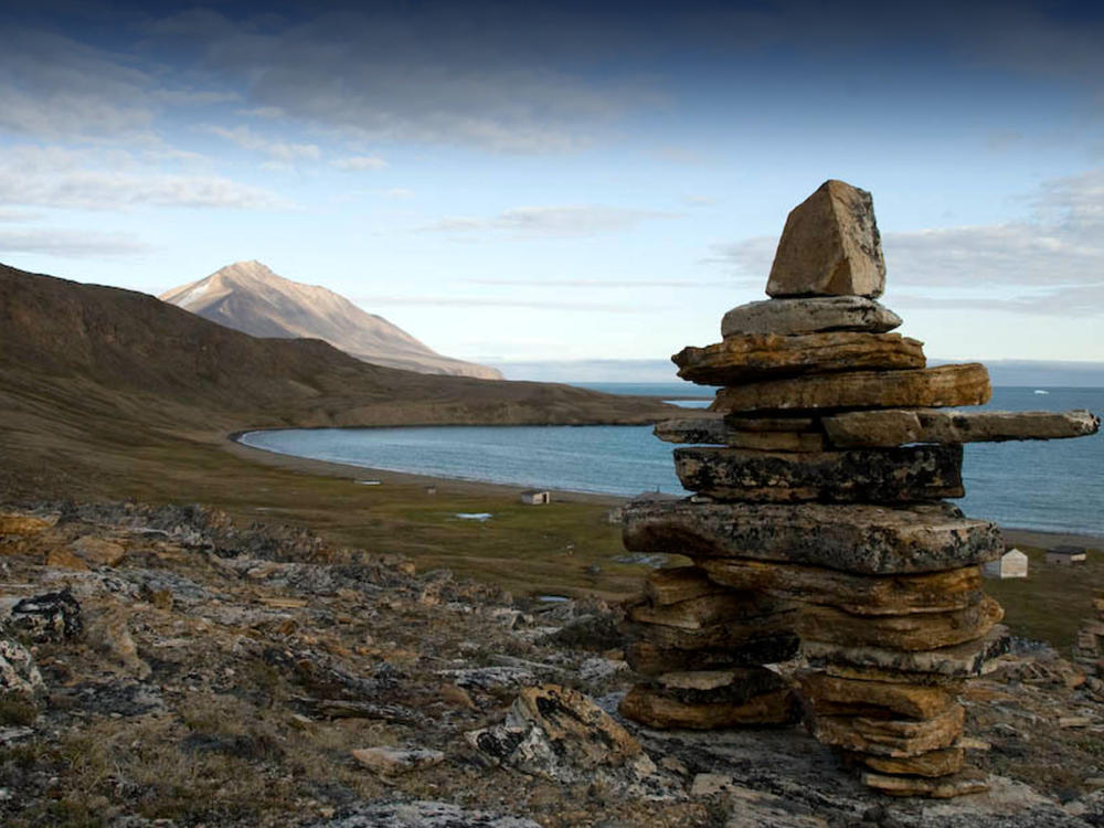 An inukshuk overlooking the water in the Canadian High Arctic