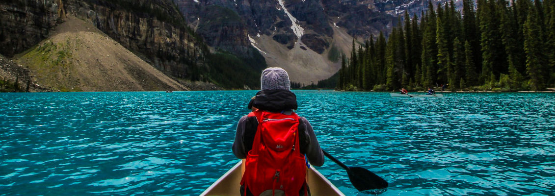 Canoeing on the incredible turquoise water of Moraine Lake, in Banff National Park.