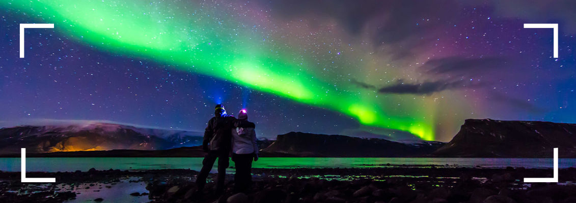 couple looking at northern lights