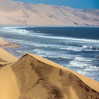 Atlantic coast of Walvis Bay, Namibia. Ocean surf with foamy waves - Namibia travel guide