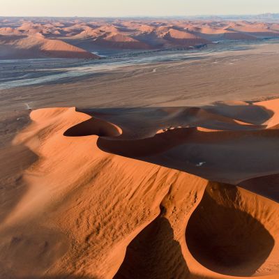 Aerial view of high red dunes, located in the Namib Desert, in the Namib-Naukluft National Park of Namibia, Africa