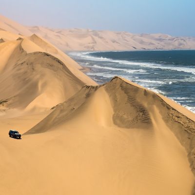 Atlantic coast of Walvis Bay, Namibia. Ocean surf with foamy waves