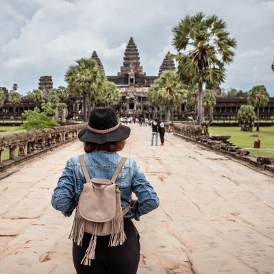 Women tourists wear jacket jeans walking into Angkor Wat landmark in Siem Reap, Cambodia, Asia