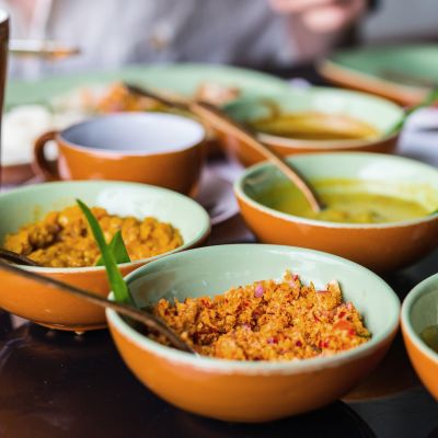 Coconut sambal and curry close up on table with Sri Lankan food, Asia