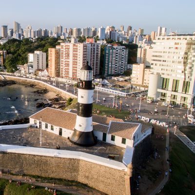 Aerial view of Barra Lighthouse and Salvador cityscape, Bahia, Brazil, South America