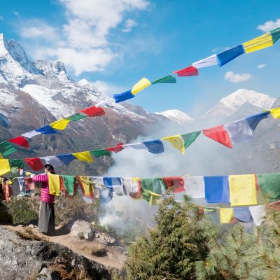 Nepali women replacing prayer flags, Namche Bazaar village, Sagarmatha Park, Himalayas, Nepal