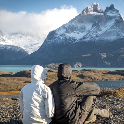 Young couple enjoying the a beautiful scenario in Torres del Paine National Park, Patagonia, Chile, South America