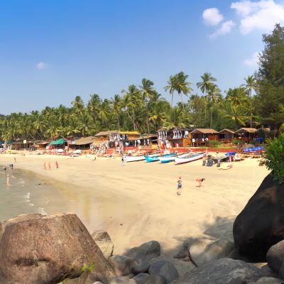 goa beach with people on the shore in India