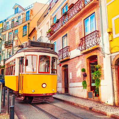 Yellow vintage tram on the street in Lisbon, Portugal