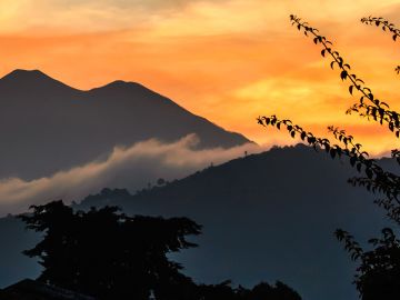 Fuego & Acatenango volcanoes at sunset, near Antigua, Guatemala