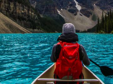 Canoeing on the incredible turquoise water of Moraine Lake, in Banff National Park