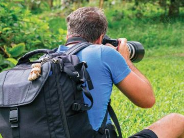 Photographer with Giant Tortoise