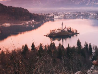 Woman looking on Bled Lake with Island
