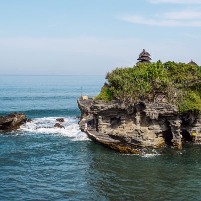 View of Tanah Lot temple on the sea at sunny day in Bali, Indonesia, Asia