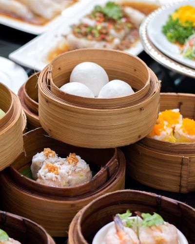 Enchanting Travels China Tours Arrangment of various dim sum in bamboo steamer
