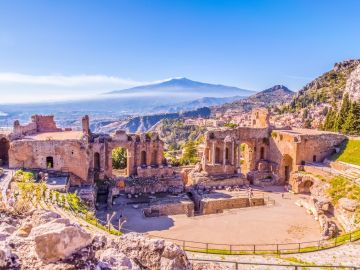 Premium Photo  Seductive sicilian woman sitting on a step in an old town  in sicily