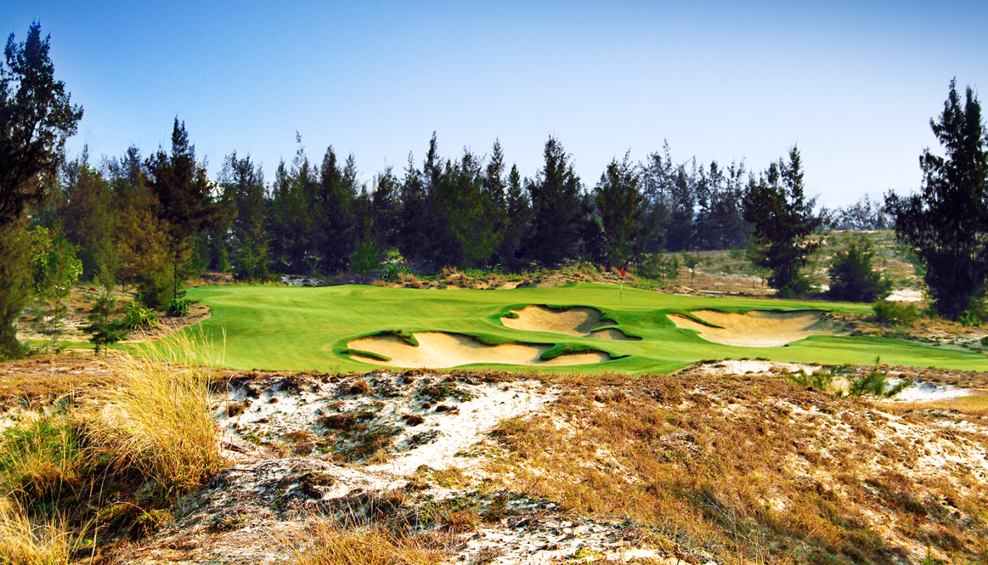 A tee box view of a hole on the Dunes Course at Da Nang Golf Club along the South China Sea in Da Nang, Vietnam.