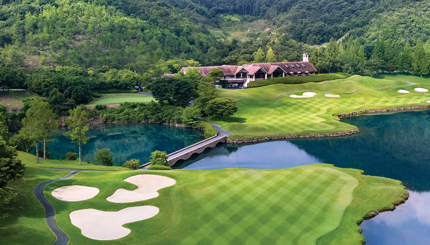 The 18th hole at Golden Valley Golf Club runs over a winding lake and up to the clubhouse just outside of Osaka, Japan.