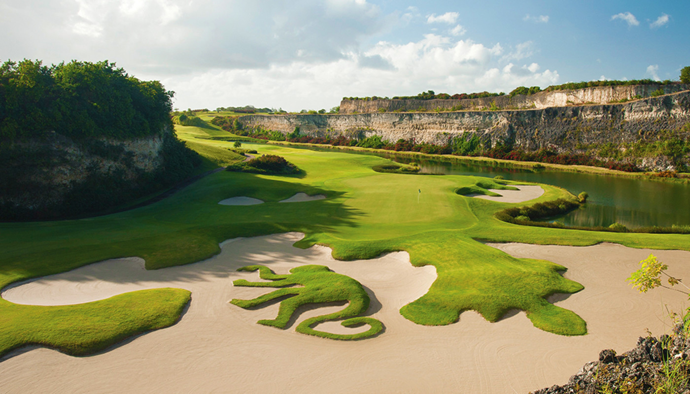 The 16th hole’s green and famous bunker, where a monkey carved of grass lies, on the Green Monkey Course at Sandy Lane in Barbados.