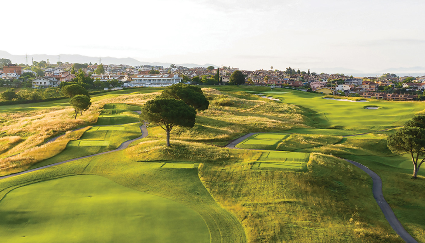 A tee box view of the par-4 11th hole at Marco Simone Golf Club alongside the town of Marco Simone in Rome, Italy.