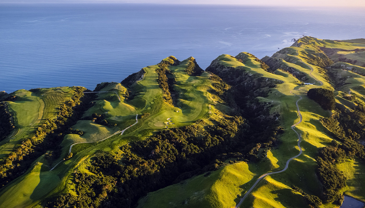 An aerial view of fairways at Cape Kidnappers Golf Course rolling out to cliffs overlooking Hawke’s Bay in New Zealand.